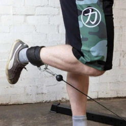 Padded Ankle Strap, Neoprene -Strength Shop ankle strap action 2 1000x1000 29c1dfb4 c3c7 4700 b727 17012c690e49